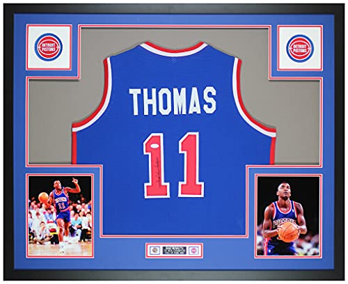 Isiah Thomas Autographed Blue Pistons Jersey – Beautifully Matted and Framed – Hand Signed By Thomas and Certified Authentic by JSA – Includes Certificate of Authenticity