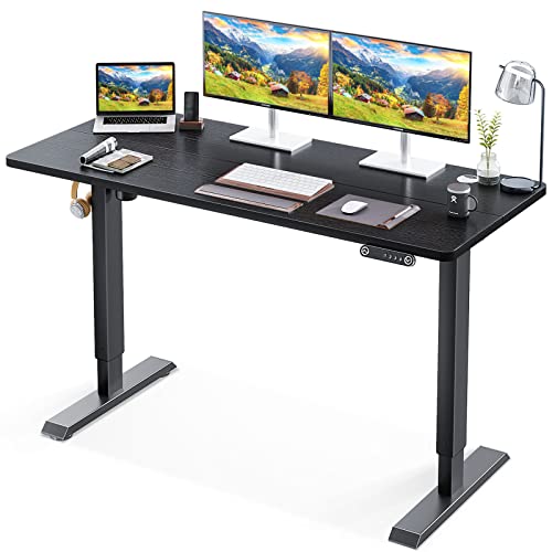 KKL 55-inch Height Adjustable Electric Standing Desk, 55 x 28 Inches Stand Up Desk with Splice Board and Hook, Sit Stand Desk with Black Top and Black Frame