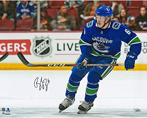 Brock Boeser Vancouver Canucks Autographed 16″ x 20″ Blue Jersey Skating Photograph – Autographed NHL Photos