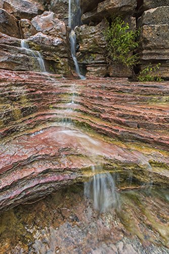 Posterazzi Water flows over a very colourful waterfall in the heart Toro National Park Bolivia Poster Print, (24 x 38)