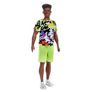 Barbie Ken Fashionistas Doll, Broad, Black Curly Hair, Multi-Colored Camo Print Shirt, Neon Green Shorts, Silvery Sneakers, Toy for Kids 3 to 8 Years Old